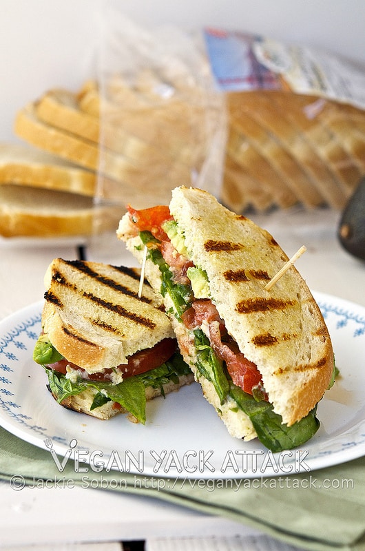 A Grilled Sourdough Sammie with tangy jalapeño lime aioli and fresh summer produce stacked inside.