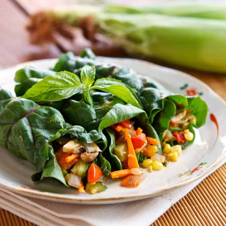Summer Garden Wraps made with a garden's beautiful bounty! Corn, zucchini, chard, basil and more make these burst with flavor. Vegan, Paleo, Gluten-free