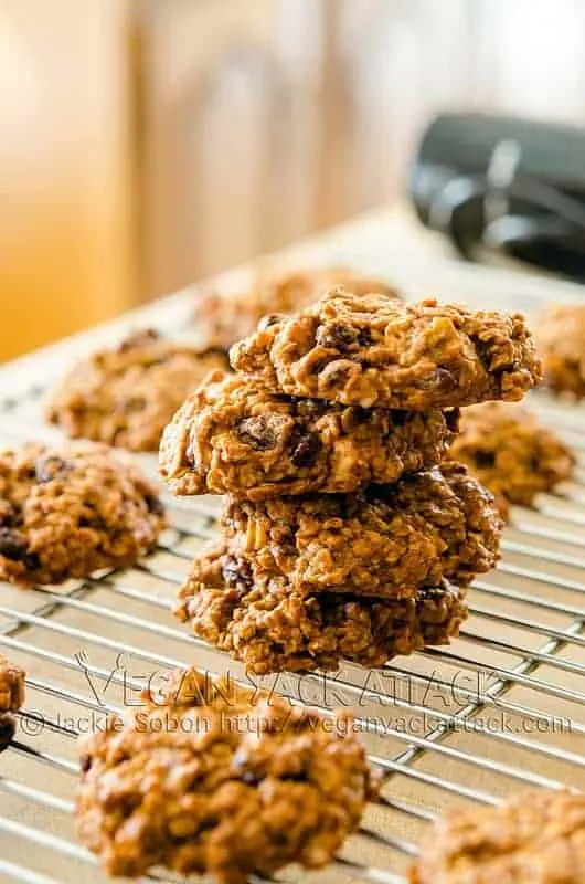 Persimmon Oatmeal Cookies stacked on one another on a cooling rack