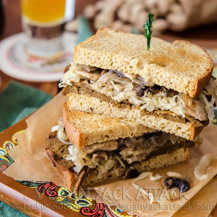 A delectably savory Seitan Sauerkraut Sandwich, complete with mushrooms, onions and horseradish sauce on toasted wheat bread!