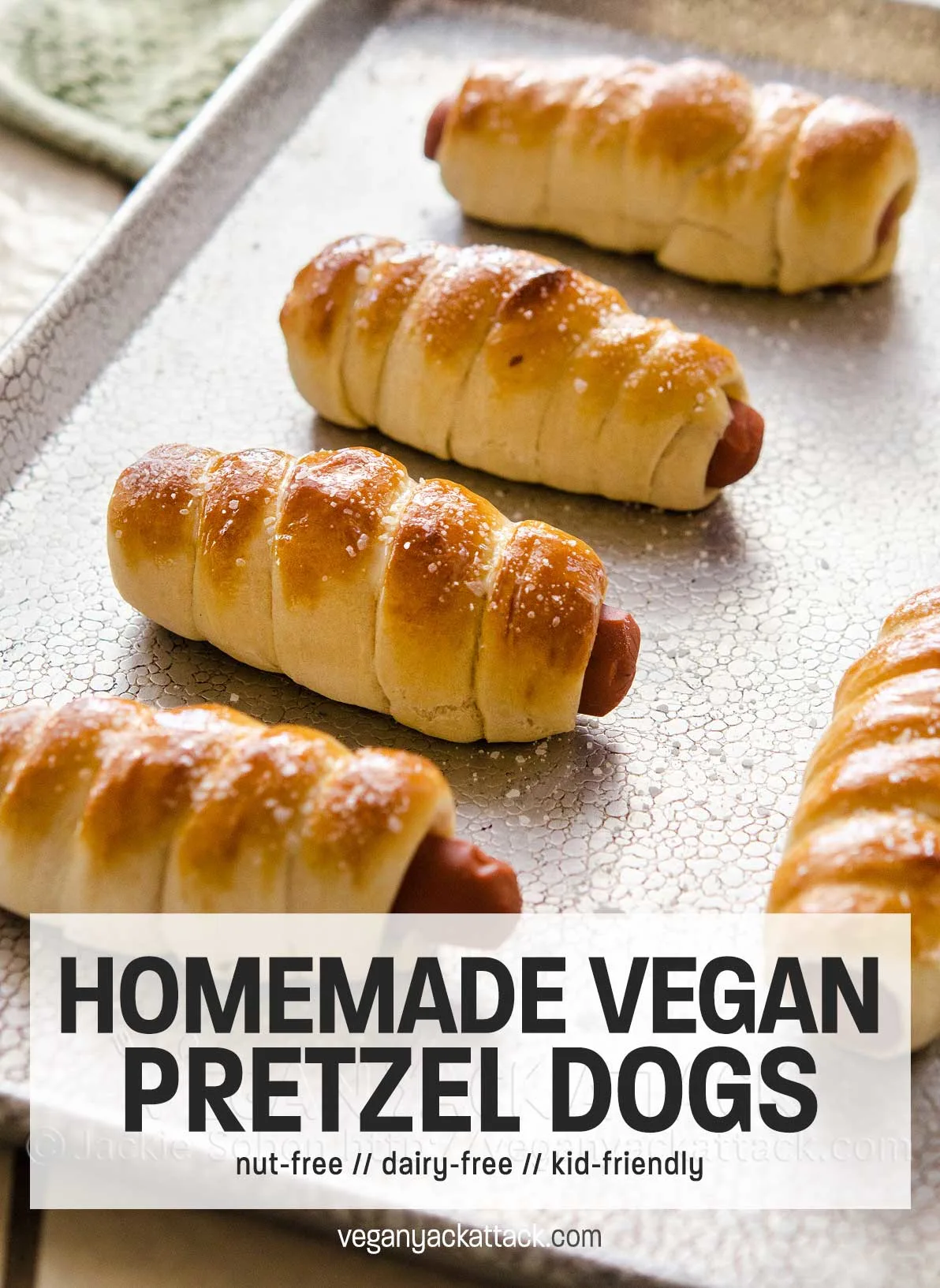 A fun recipe for vegan pretzel dogs, plus you can enter for a chance to win your own copy of Bake & destroy, by Natalie Slater! sheet pan of hot dogs wrapped in pastry with with text overlay "homemade vegan pretzel dogs"