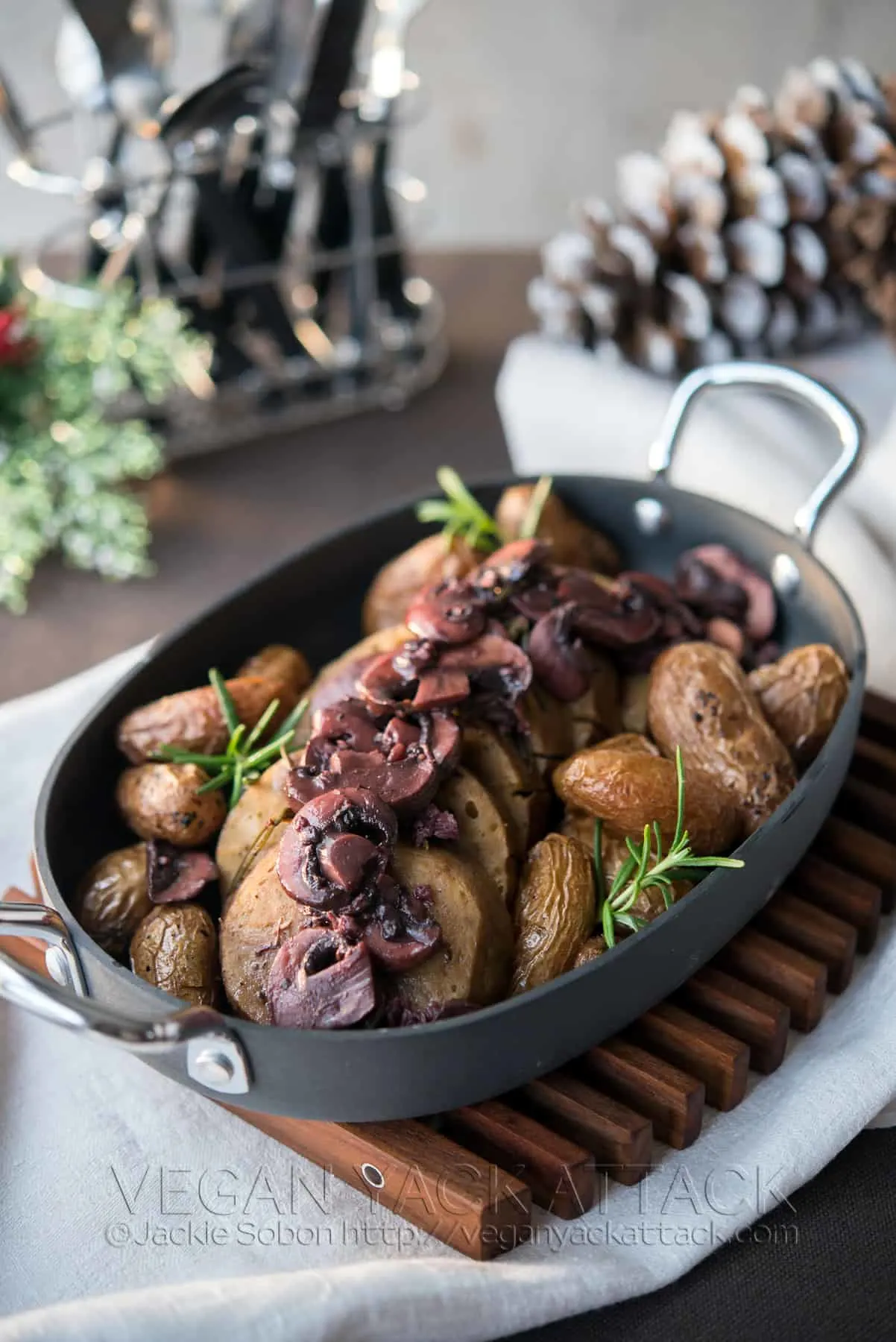 Pressure Cooker Seitan with Red Wine Mushroom Sauce in an oval baking dish with potatoes