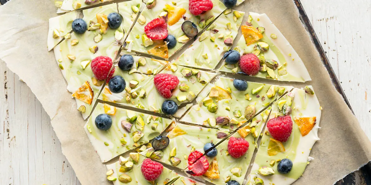 Spring Vegan White Chocolate Matcha Bark on a parchment-lined baking sheet