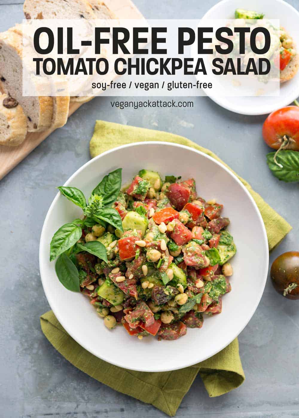 Oil-free Pesto Tomato Chickpea Salad in a white bowl on a steel background 