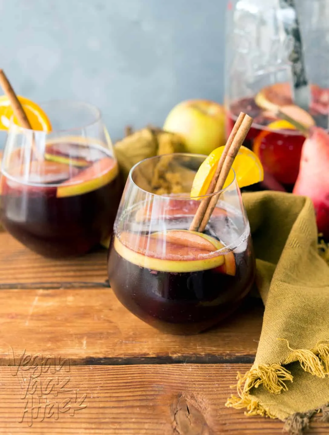 glasses of red wine sangria on a wood table top