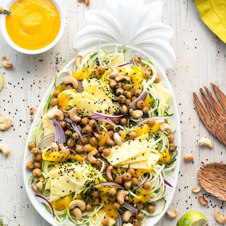 Pineapple Teriyaki Chickpea Zoodles! A fun and easy dish that is delicious and healthy. Serving it up on a pretty platter doesn’t hurt either! #vegan #veganyackattack #lenoxusa