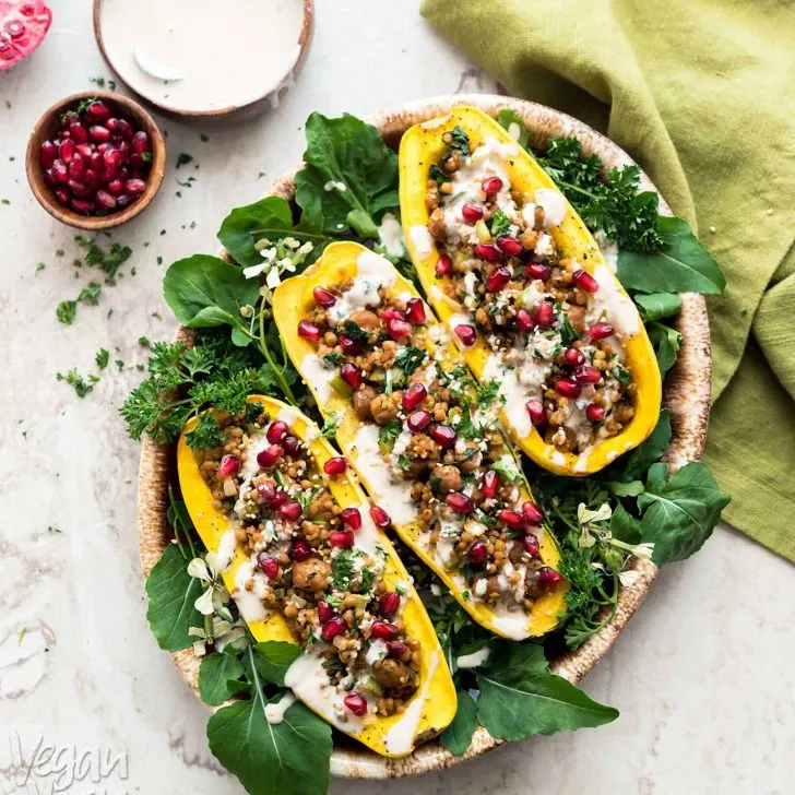 These Couscous-Stuffed Delicata Squash make for a beautiful and comforting dish, to adorn your holiday table, this year! Made with Wild Garden Pilaf. #vegan #soyfree #nutfree