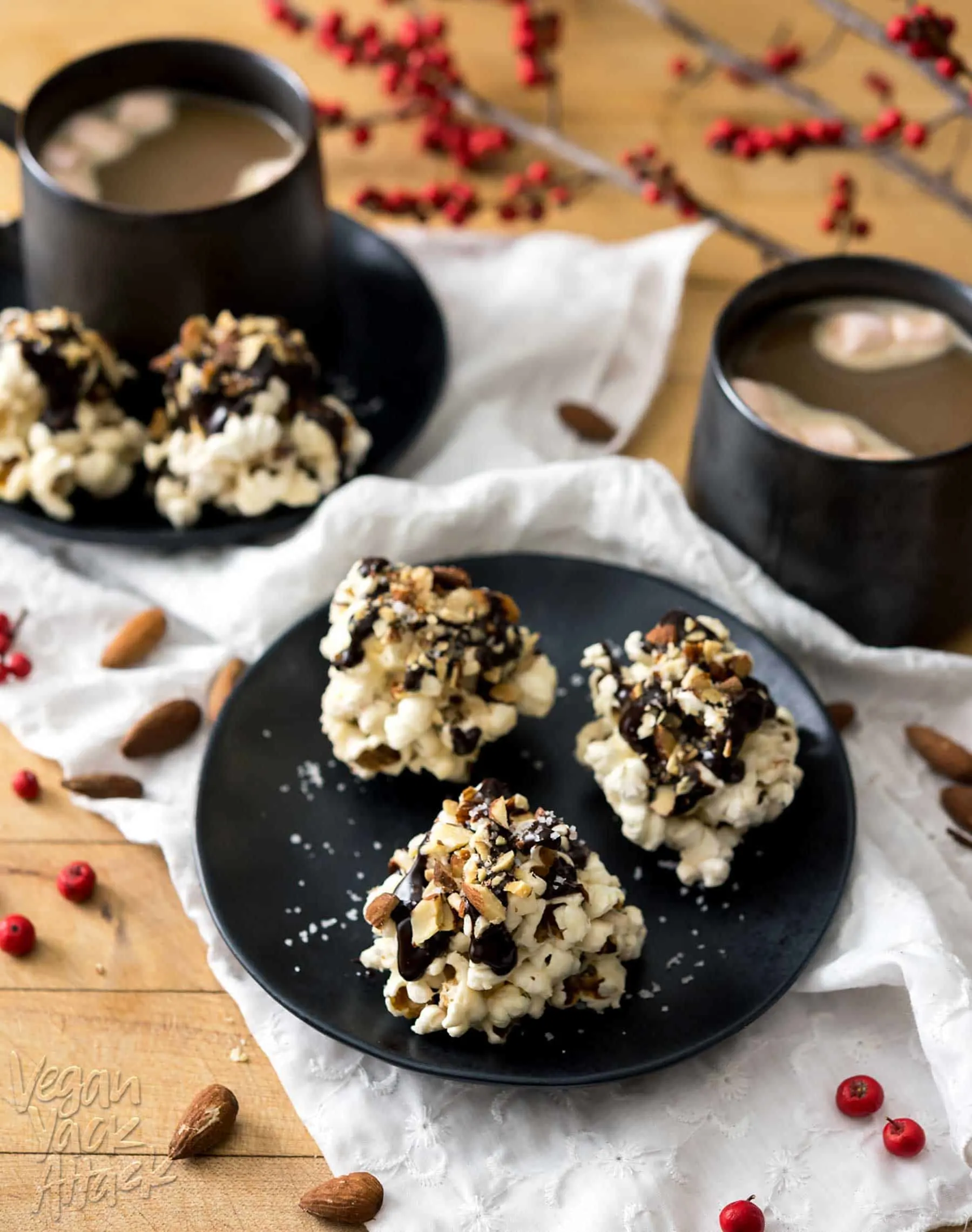 Rocky Road Popcorn Clusters are a wonderfully easy treat to make for holiday festivities, or as gifts for the sweet lovers in your life! Chewy, chocolate-covered, with toasted almonds and salt, what&rsquo;s not to love? #vegan #glutenfree