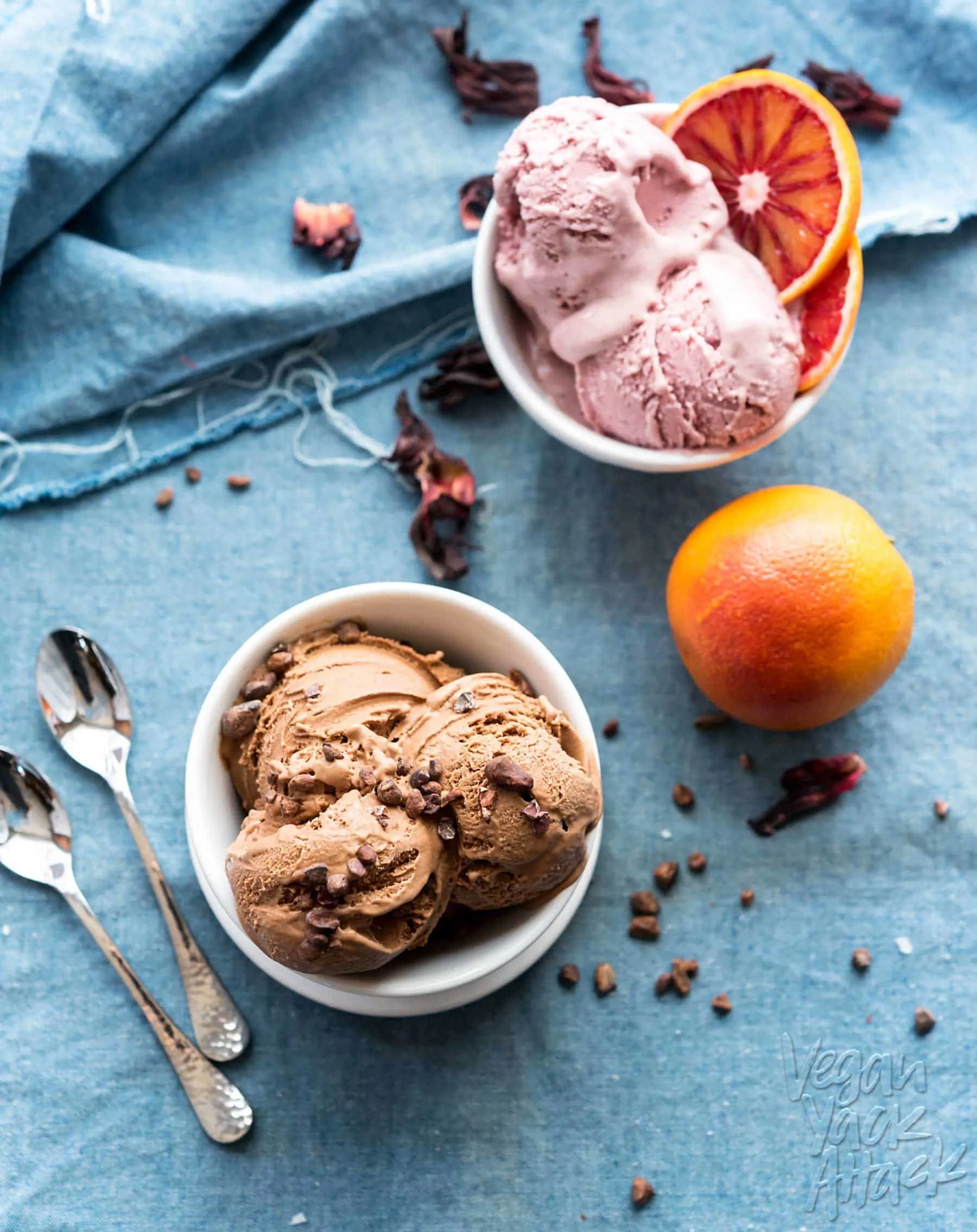 Image of two bowls of vegan protein ice cream in white bowls on denim fabric