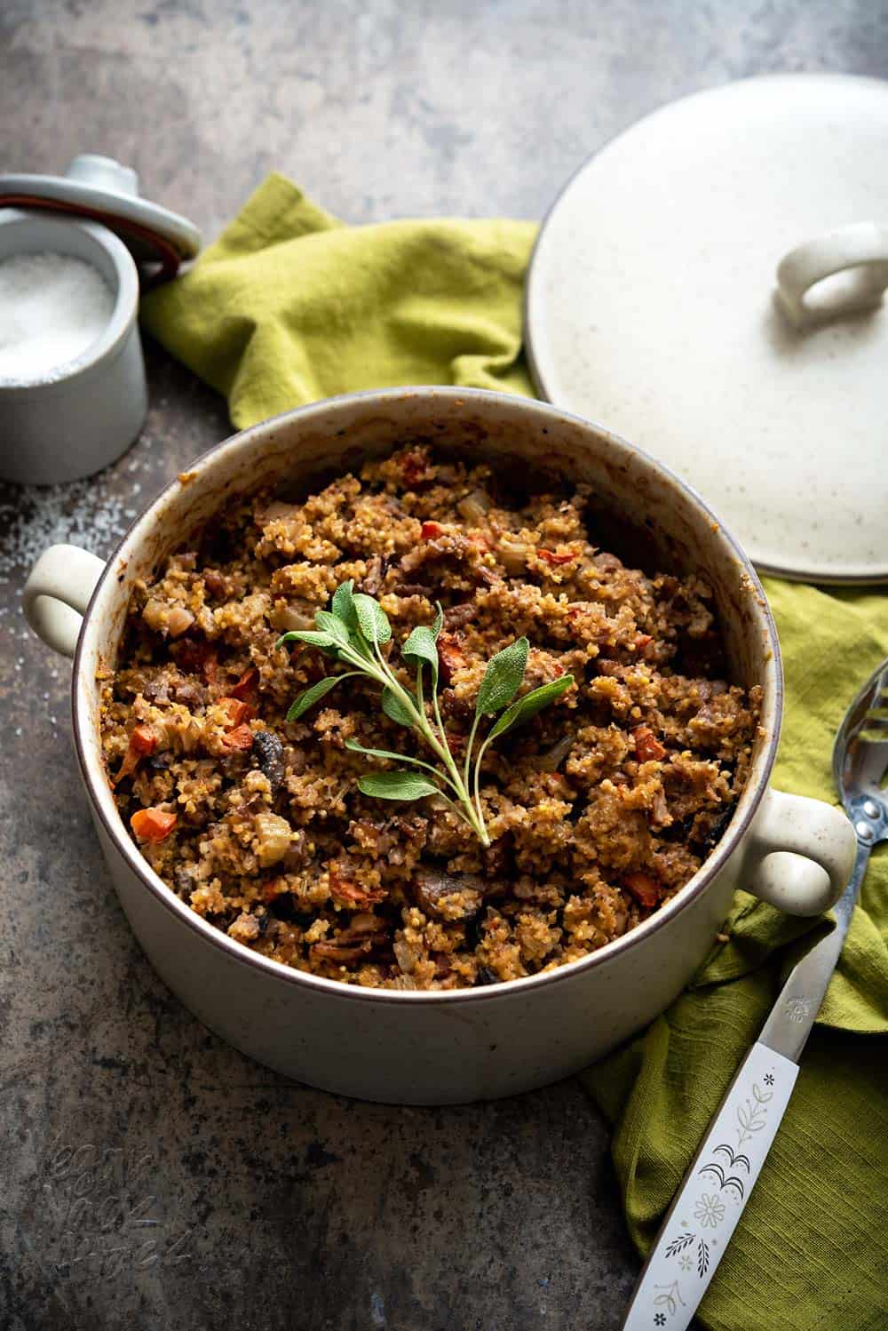 Stuffing is one of my favorite sides, at holiday dinners. So that no one feels left out, I've made this tasty, Gluten-free Millet Stuffing for everyone! Plus, it's in the cutest baking dish. #vegan #Danskdesign #dansk #thanksgiving #glutenfree
