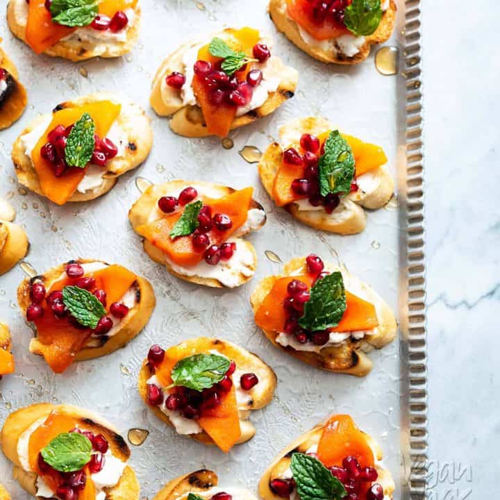 These Pomegranate Persimmon Crostini are as delicious as they are gorgeous. Plus, VERY easy-to-make! #vegan #soyfree #appetizer #veganyackattack