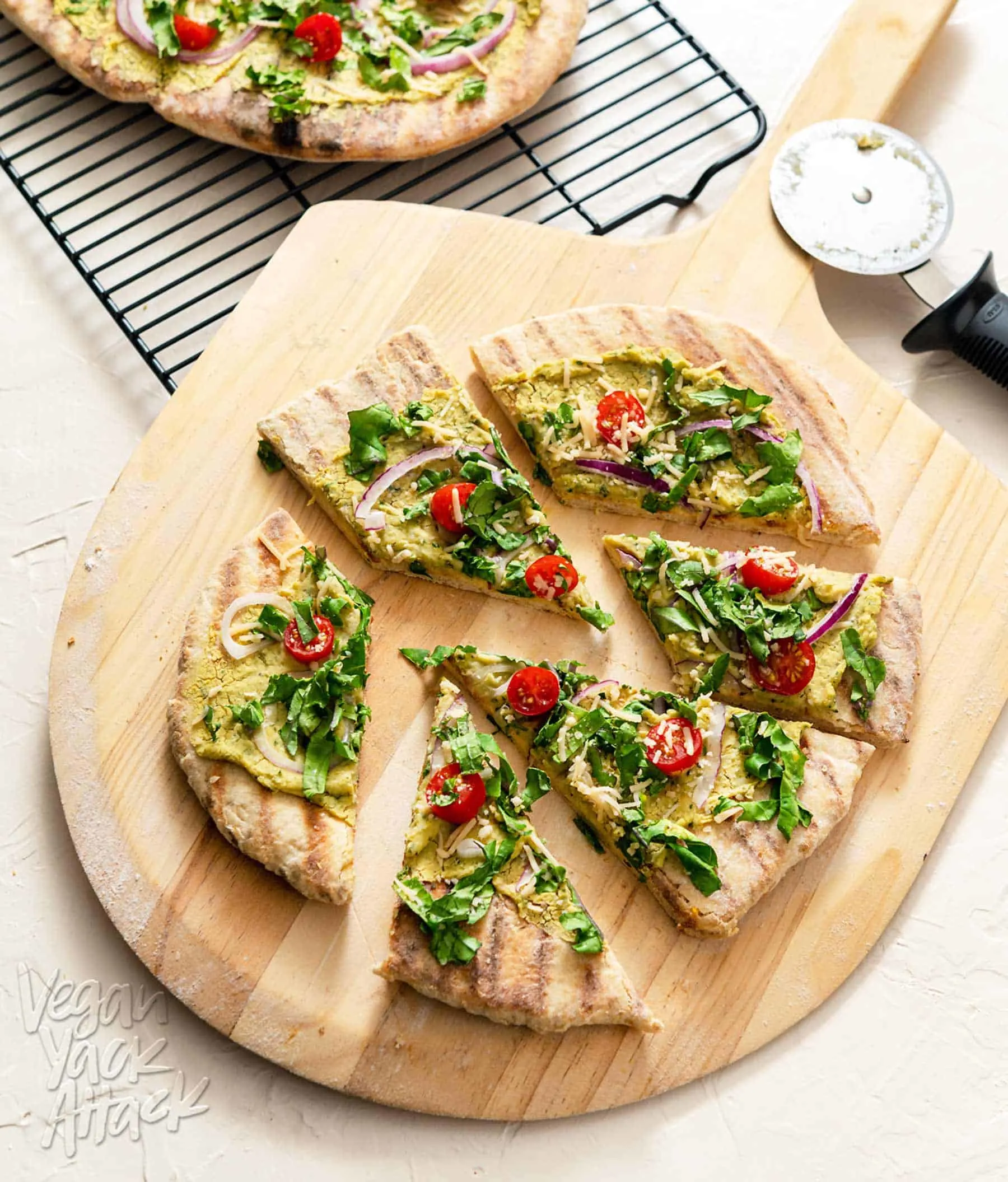 Grilled Sourdough Flatbread cut into slices on a wooden pizza peel
