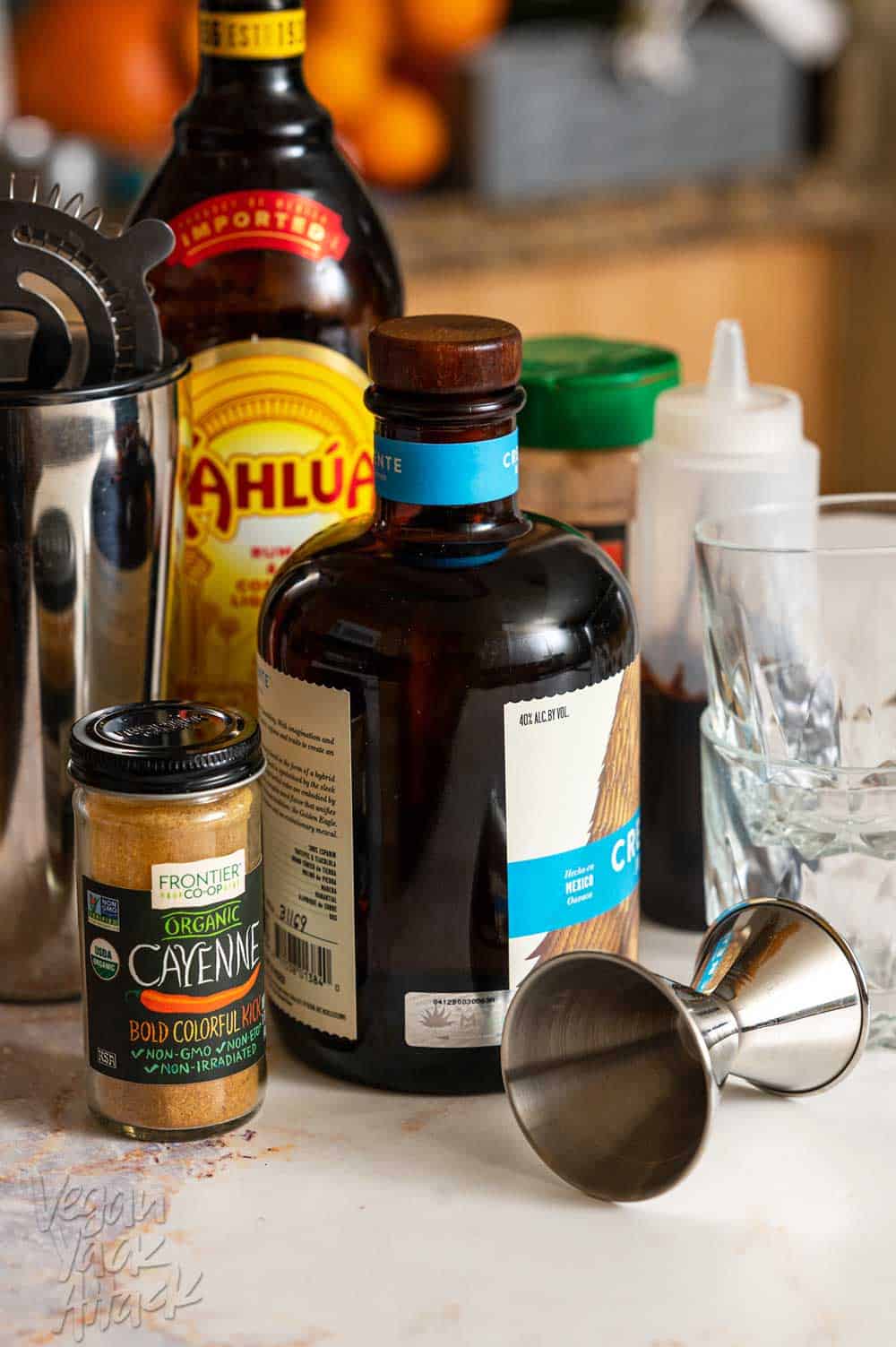 Ingredients for mocha mezcal dessert cocktail on a countertop