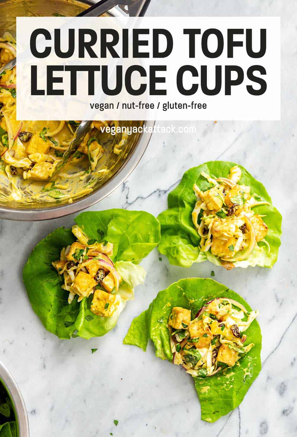 several curried tofu lettuce cups on a marble surface