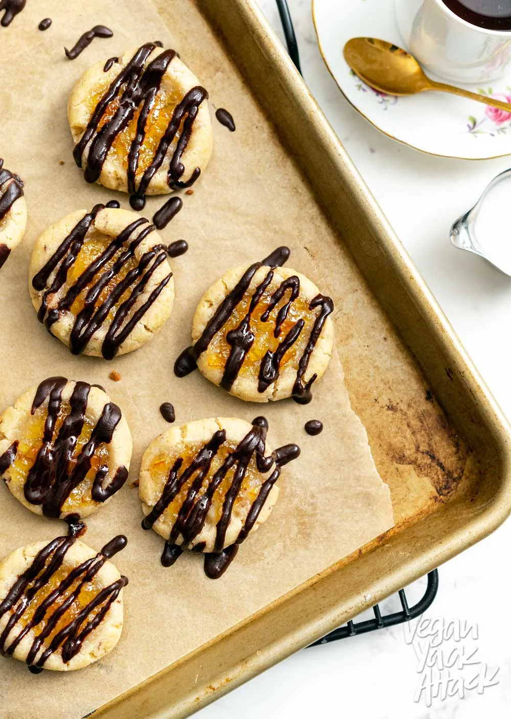 Close up of vegan orange marmalade cookies with chocolate drizzle