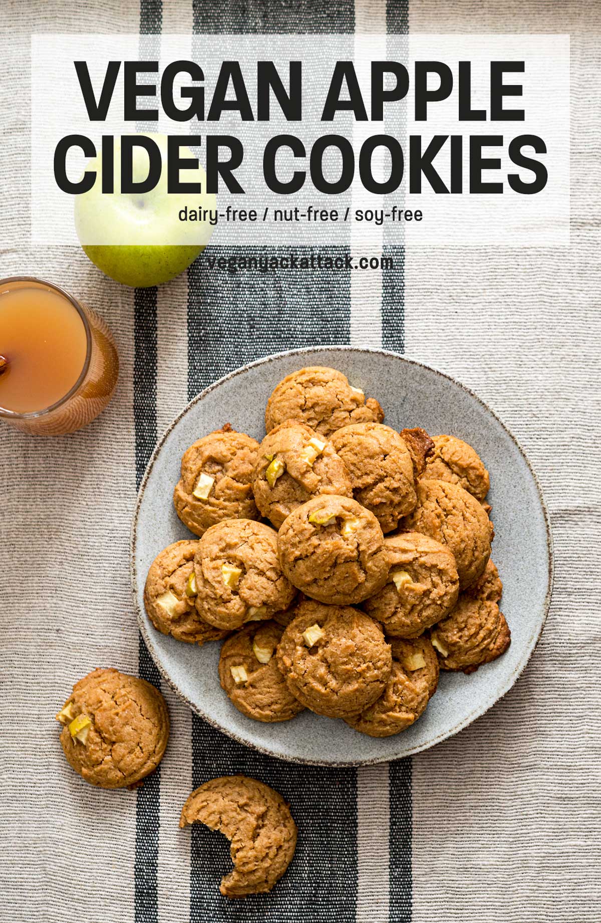 cookies in a pile on a grey plate next to a mug of cider with text overlay "vegan apple cider cookies"