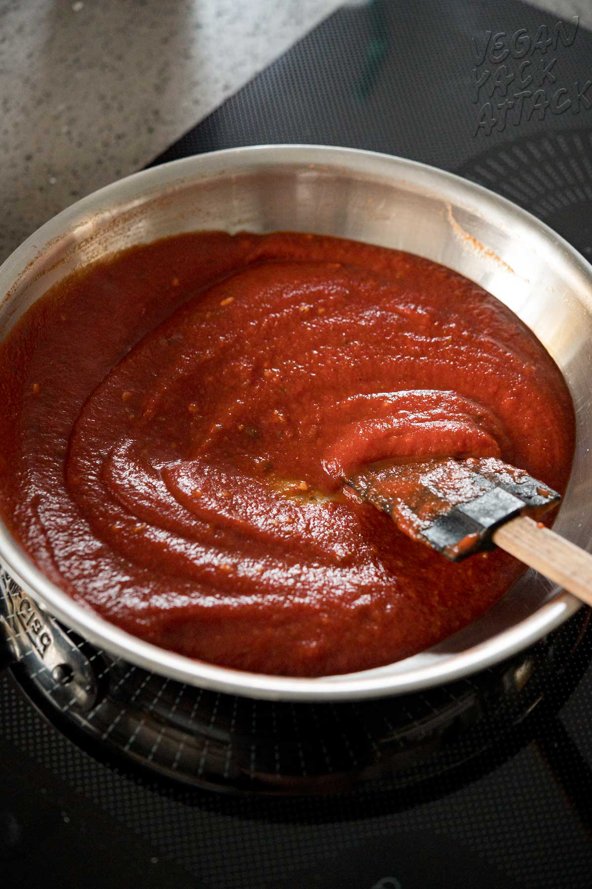 Thick marinara sauce in a small sauce pan