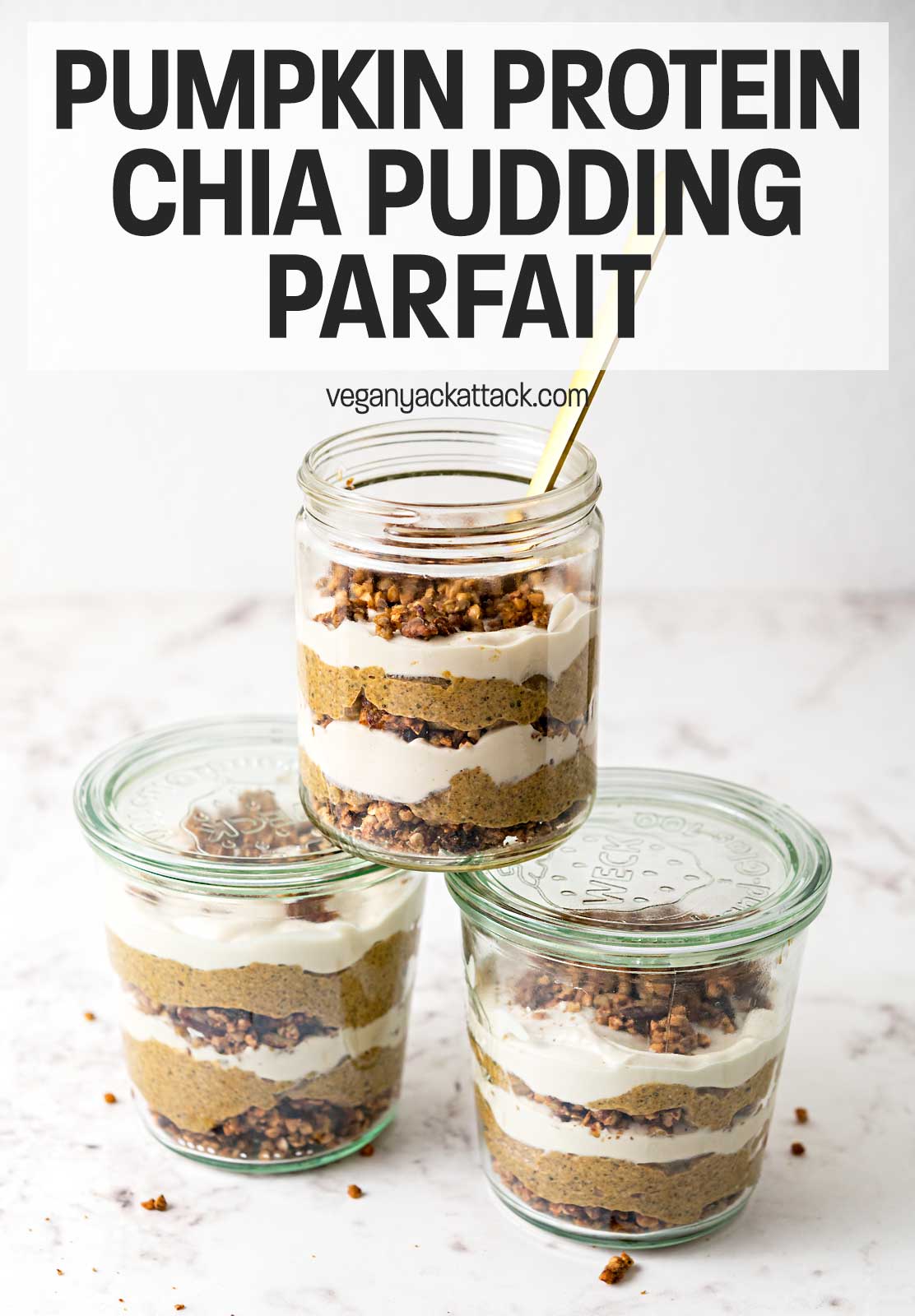 three jars of pumpkin pudding parfait stacked together on a marble table top