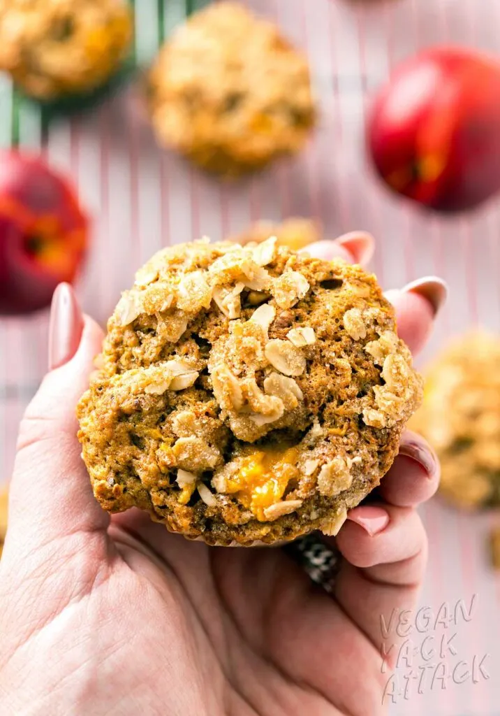 Hand holding nectarine muffin